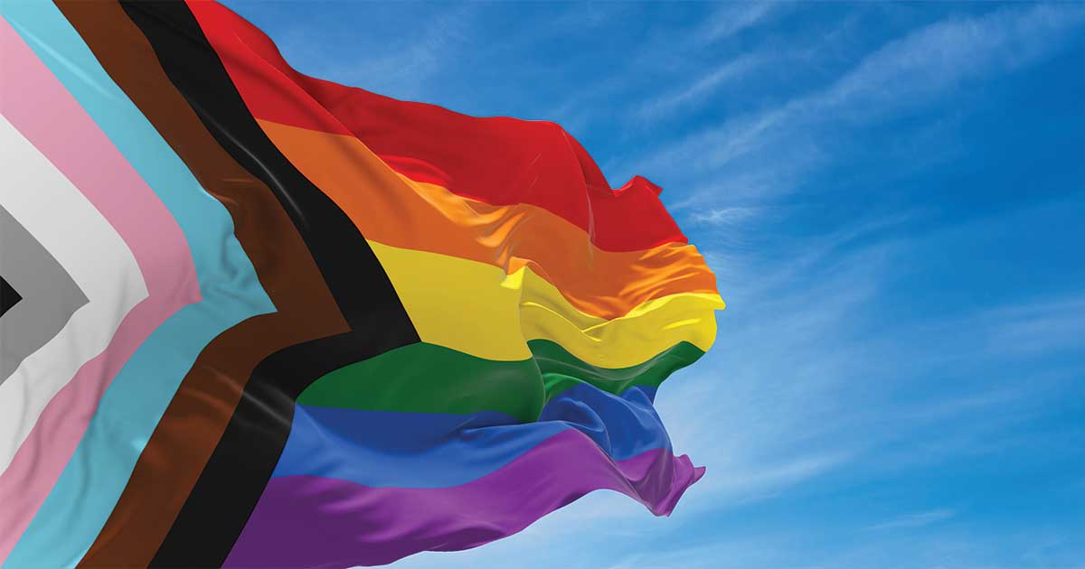 Progress Pride flag fluttering in the wind